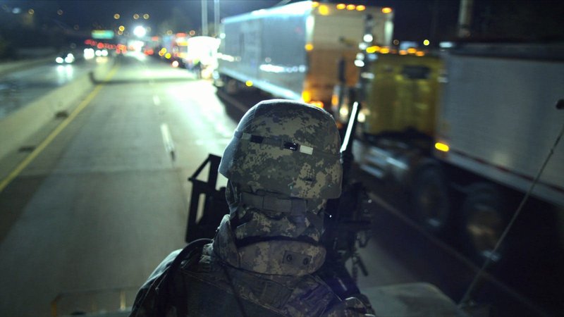 army personnel on a army JEEP 